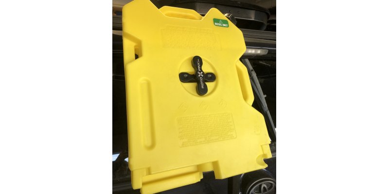 RotoPax fuel and water containers mounted on a 4Runner ladder for Alaska Overlanding and Auroralander backcountry travel.