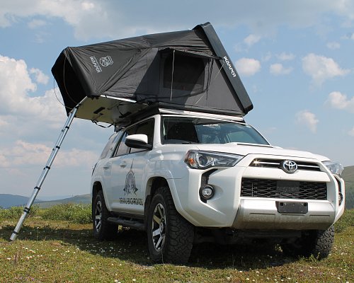Denali Backroads white Toyota 4Runner Overlander with the iKamper opened on the top