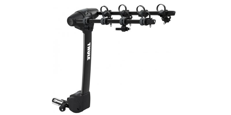 Thule XP hitch-mounted bike carrier holding up to four bicycles, shown as an Auroralander adventure accessory for Alaska travel.